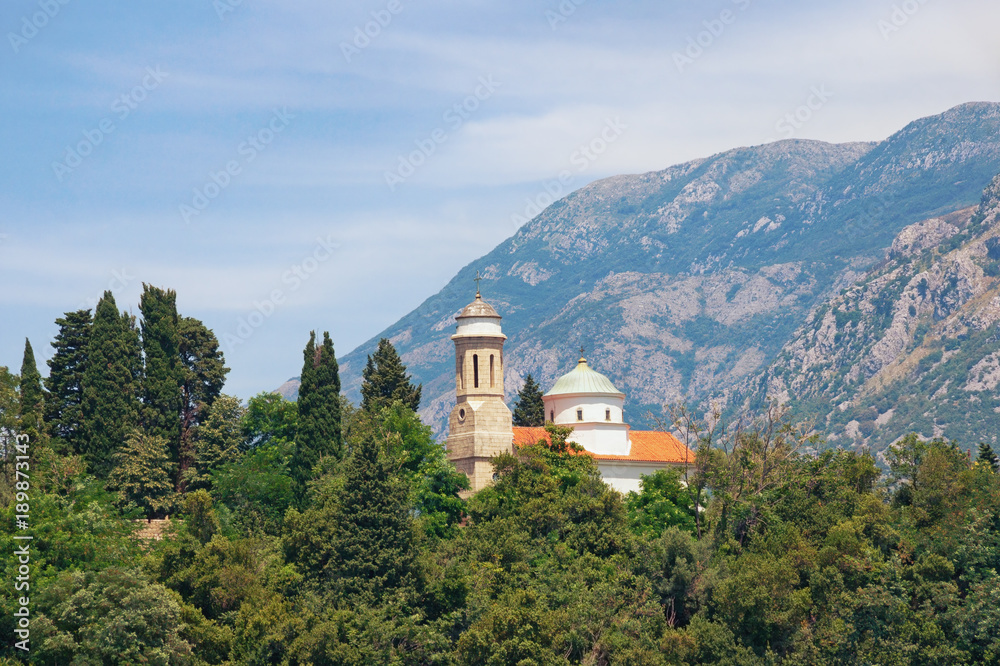 Church on a background of mountains.  Kamenari, Montenegro