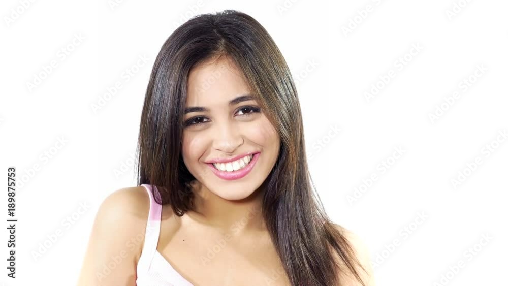 Cute shy latina girl smiling looking camera isolated Cute shy latina girl smiling looking camera isolated