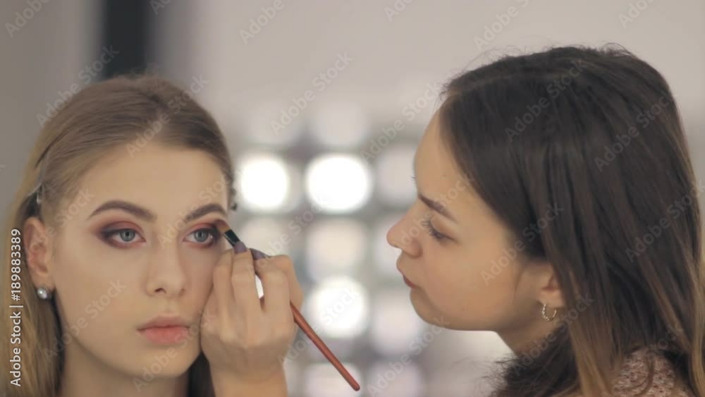 Professional makeup artist and hairstylist creates a beautiful image for a beautiful young girl. Professional makeup artist and hairstylist creates a beautiful image for a beautiful young girl.