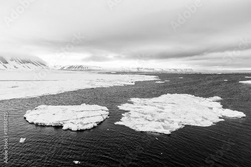 Iceberg floats in the polar sea of ​​Svalbard, Spitsbergen, Norway photo