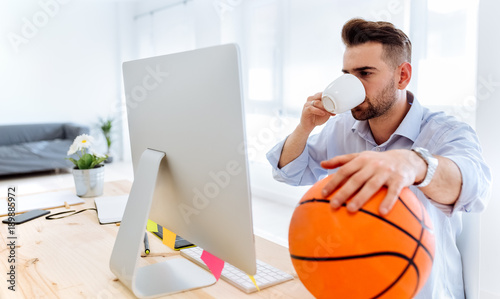 Young man working and drinking coffee