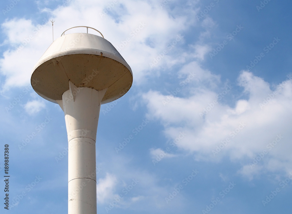 old white metal water tower with cloud and blue sky background, water steel tank for public utilities water supply or agricultural areas, close up with copy space old white metal water tower with cloud and blue sky background, water steel tank for public utilities water supply or agricultural areas, close up with copy space