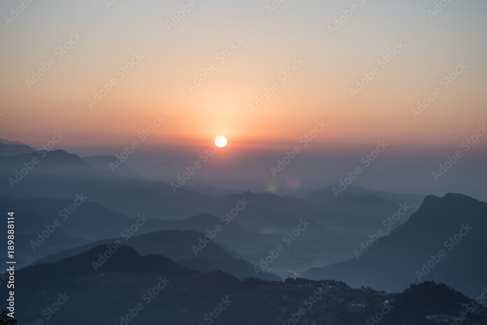 The rising sun and a mountains range. Nepal, Himalaya, near Pokhara