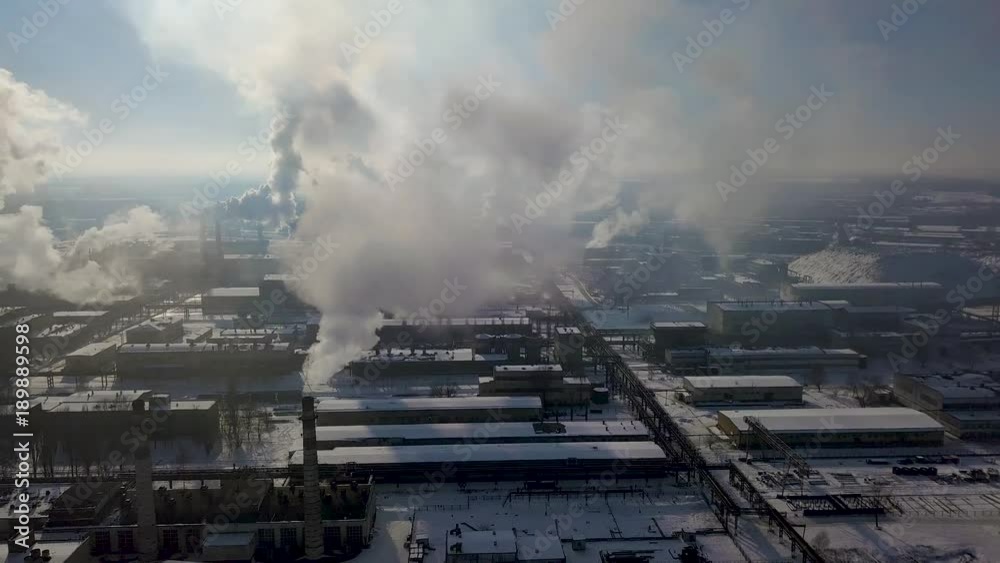 Aerial view of factory smoke stack - Oil refinery, petrochemical or chemical plant in winter Aerial view of factory smoke stack - Oil refinery, petrochemical or chemical plant in winter