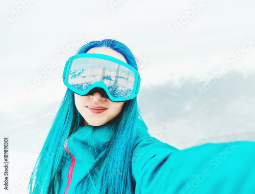 Snowboarder taking selfie, pov.