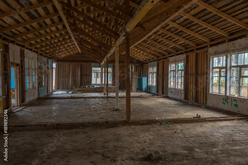 Interior of an abandoned building with broken windows