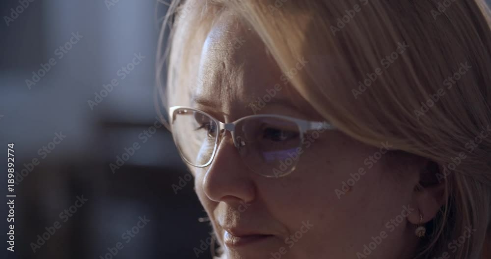 Woman in eyeglasses using computer Woman in eyeglasses using computer
