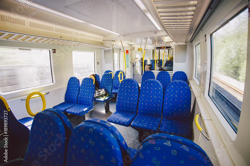 Interior inside the seat of blue in a regional train in Sweden. Concept of transport and railroad