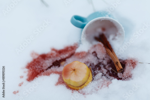 Hot winter drink on snow in forest
