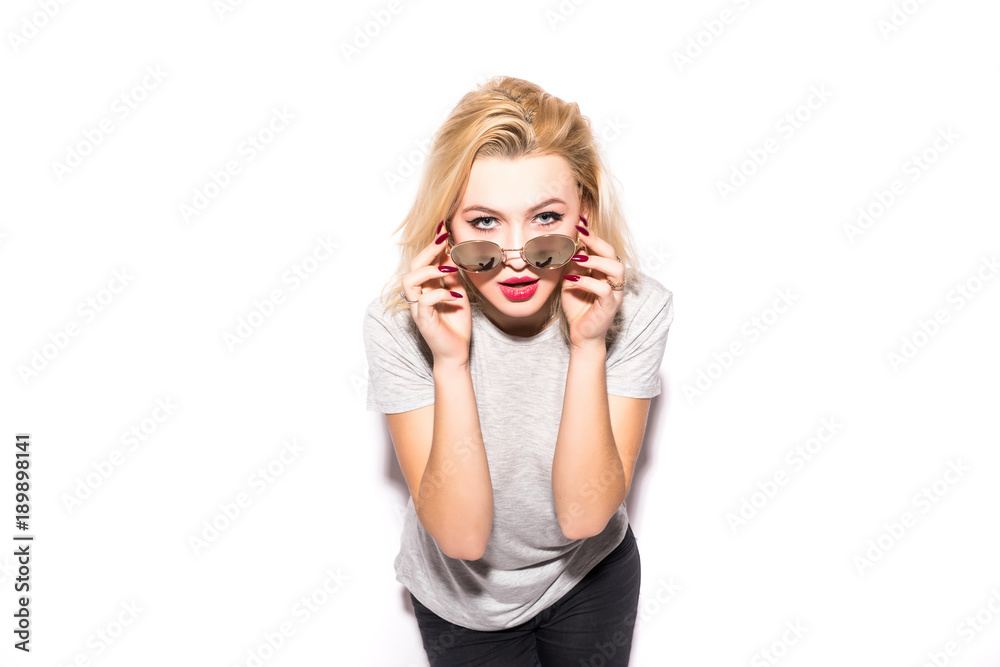 portrait of beautiful blonde girl looking over her sunglasses isolated on white background portrait of beautiful blonde girl looking over her sunglasses isolated on white background