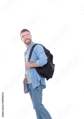 A male student with a school bag holding books isolated on white background. Education opportunities. College student.