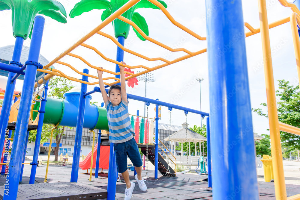 Young asian boy hang out door playground Young asian boy hang out door playground