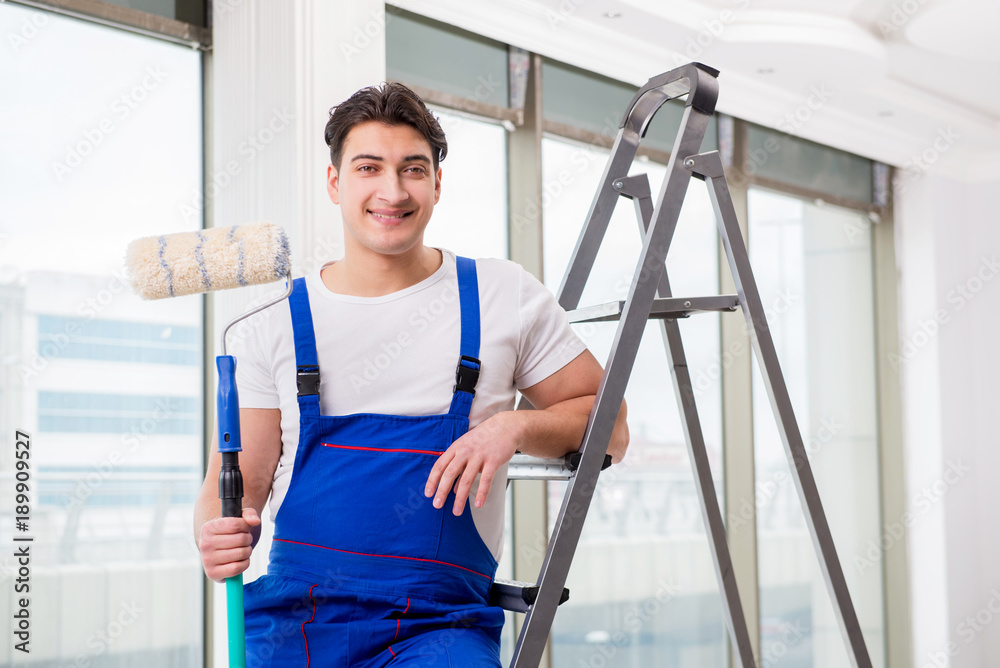 Painter repairman working at construction site