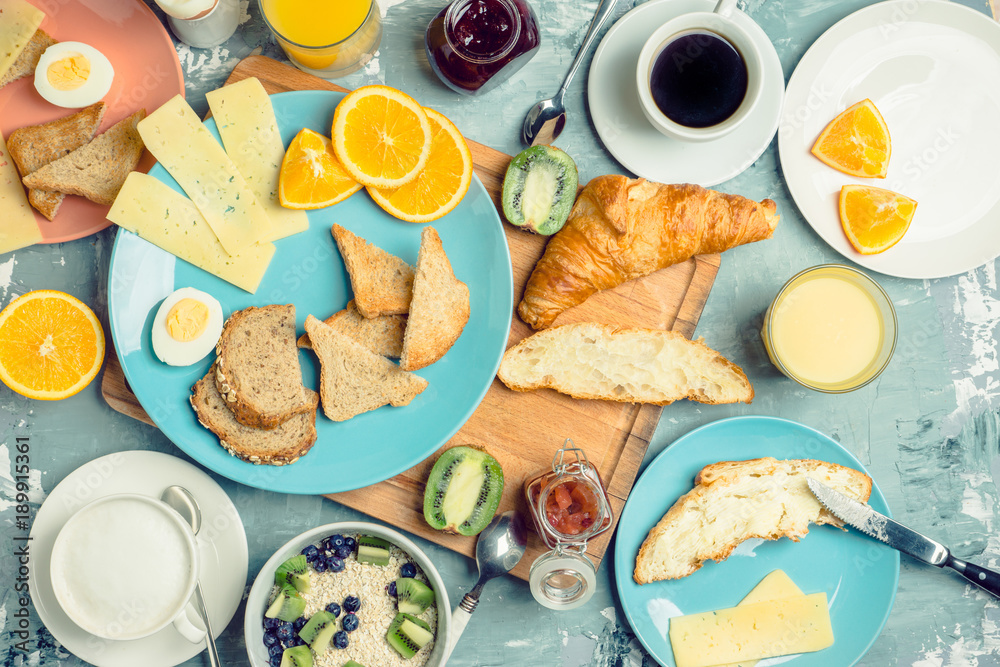 Breakfast table with various food. Selective focus. Breakfast table with various food. Selective focus.