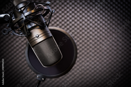 Slika na platnu condenser microphone in recording studio, music background