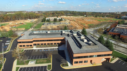 Montgomery County, Maryland - Tech Corridor Development - Aerial of Commercial Office Building with Construction Site in the Distance photo