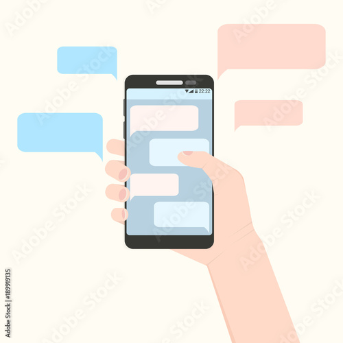 Right hand holding smartphone with pink and blue message clouds. European handle mobile phone with his finger touching screen with discussion bubbles