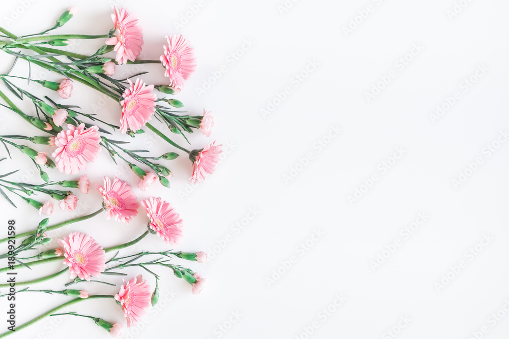 Flowers composition. Frame made of pink gerbera flowers on white background. Flat lay, top view, copy space