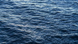 Sea surface as natural background, color toned.