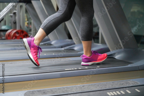 close-up on woman leg running on treadmill after her work