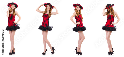 Young redhead girl in polka dot dress and sombrero isolated on 