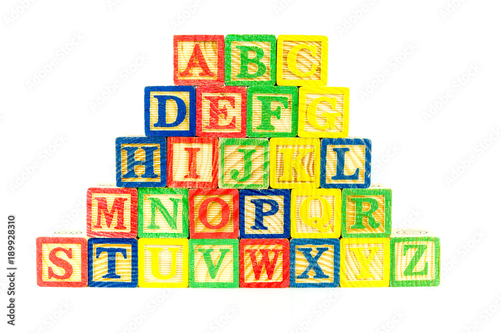 Close up arrangement of alphabet isolated on white background. Preschool, education concept or other your content.