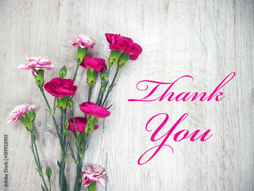 Pink flowers on a wooden light background thank you