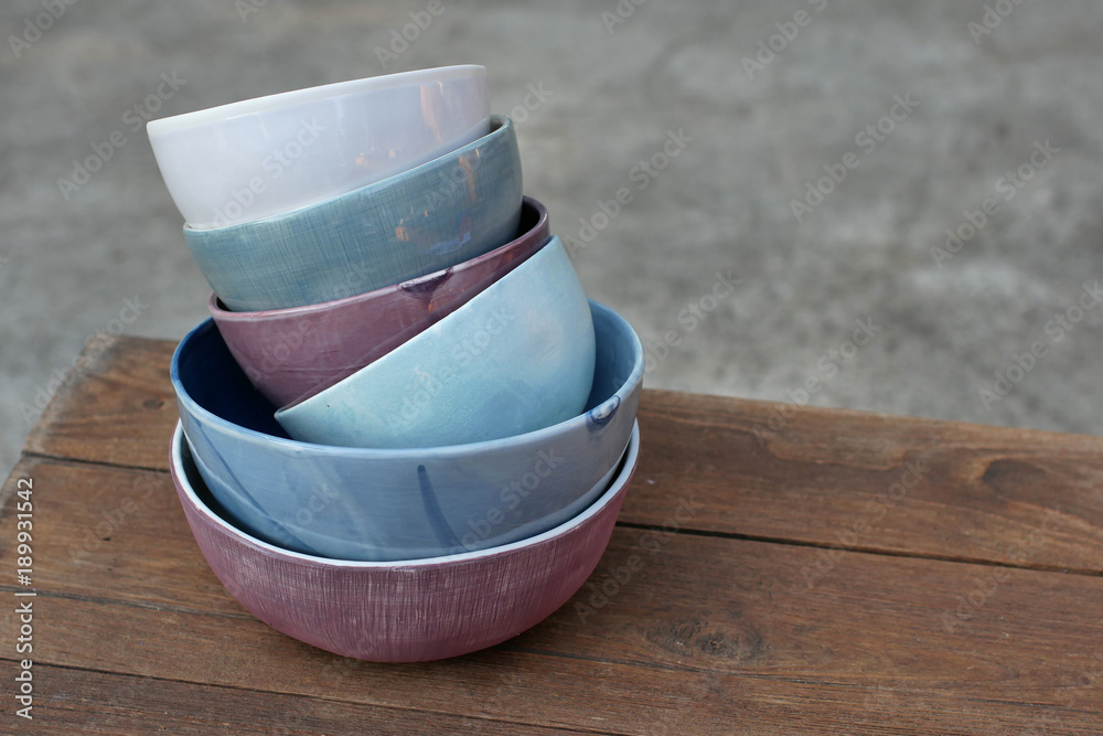empty plates and bowls, kitchenware on wooden background empty plates and bowls, kitchenware on wooden background