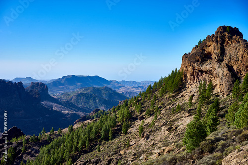 Mountainous landscape around famous "Roque Nublo" - a mountain peak on Gran Canaria / Valleys and mountains in Spain