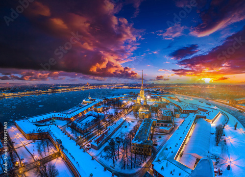 Center of Petersburg. Peter-Pavel's Fortress. Russia. Snow-covered city from a height. Winter view of St. Petersburg on the Neva River. Russia. Winter Petersburg. © Grispb