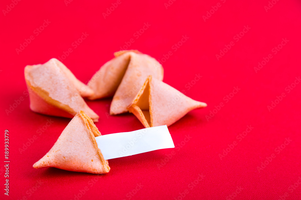 Fortune cookies with blank predictive label on red background