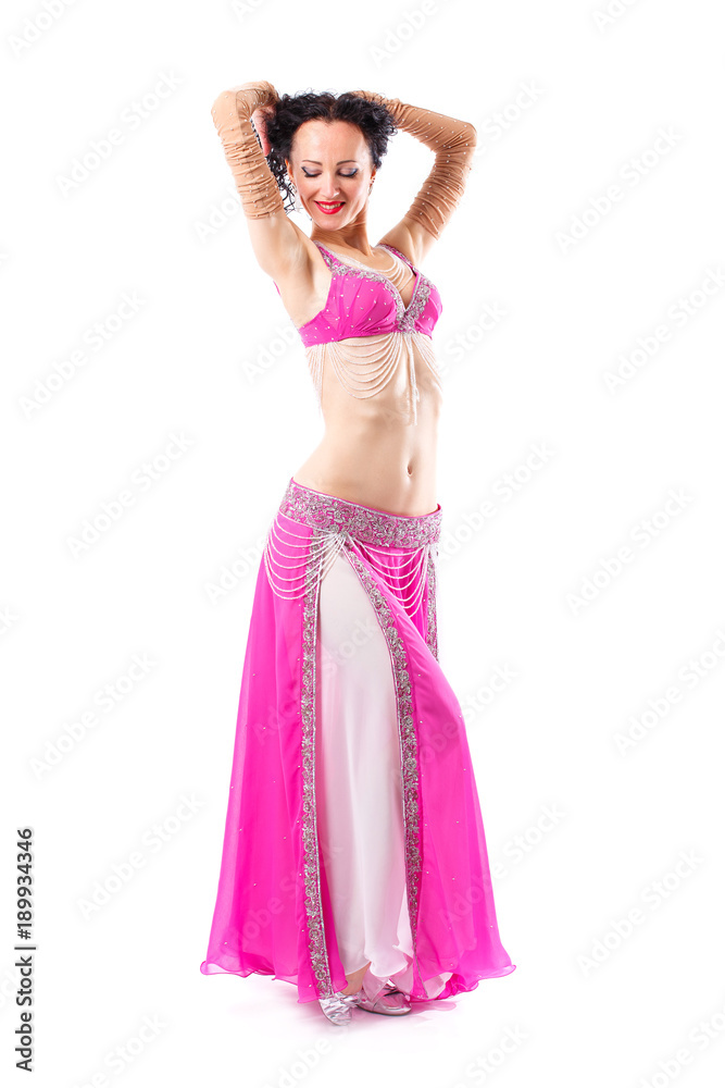 Sensual arabic girl belly dancer dancing in studio