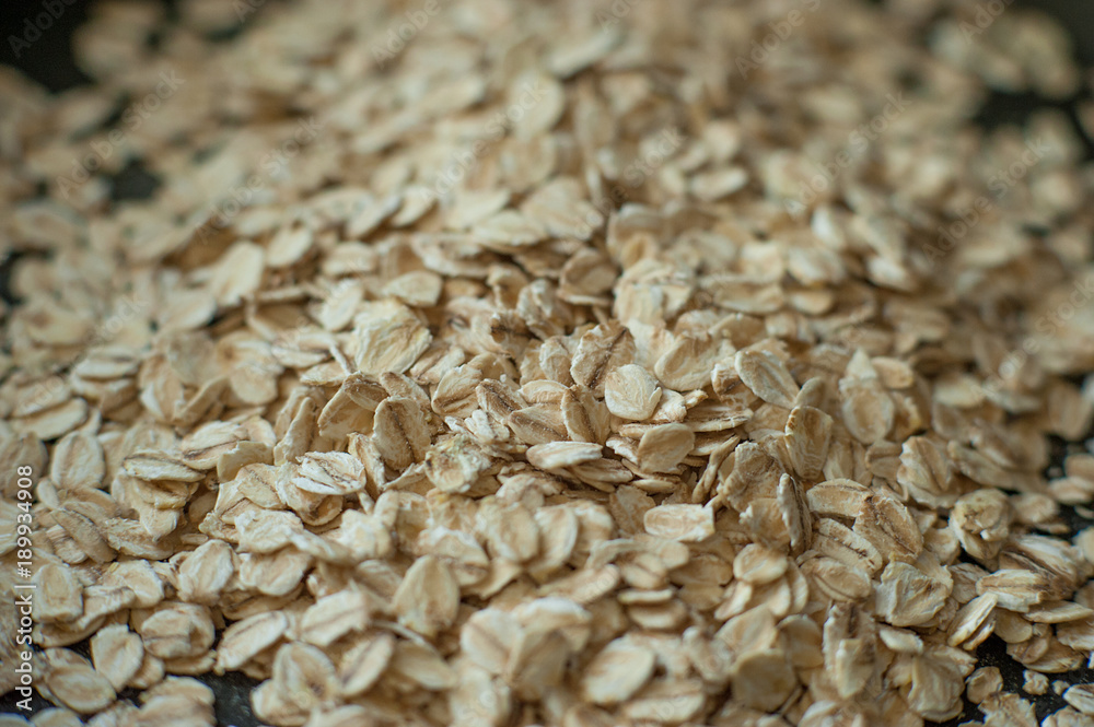 Obraz premium healthy eating. raw oat flakes