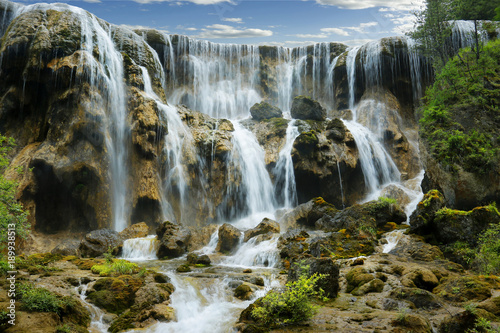 view of colorful lake and waterfall in jiuzhaigou national park, Sichuan, china photo