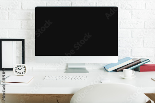 Designer desktop with blank computer