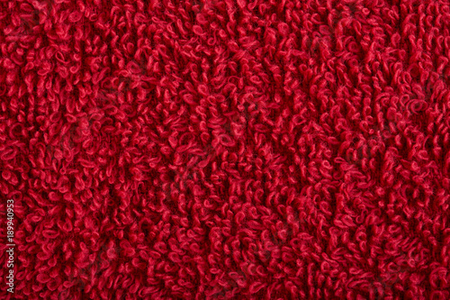 Fotografi red fabric and texture concept - close up of a towel terrycloth or terry textile