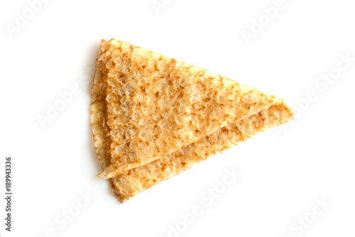 Close up on a folded crepe (french pancake) isolated on white background