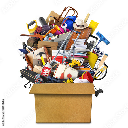 Large pile of household things in a box