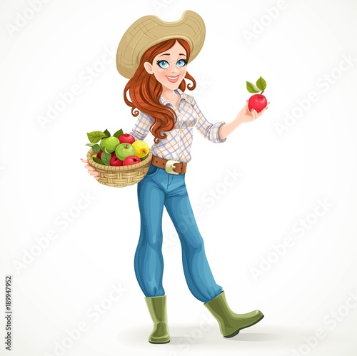 Beautiful girl farmer with ripe apples in a basket offers to try isolated on white background