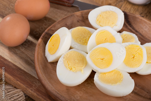 Sliced Hard Boiled Eggs on a Wooden Plate