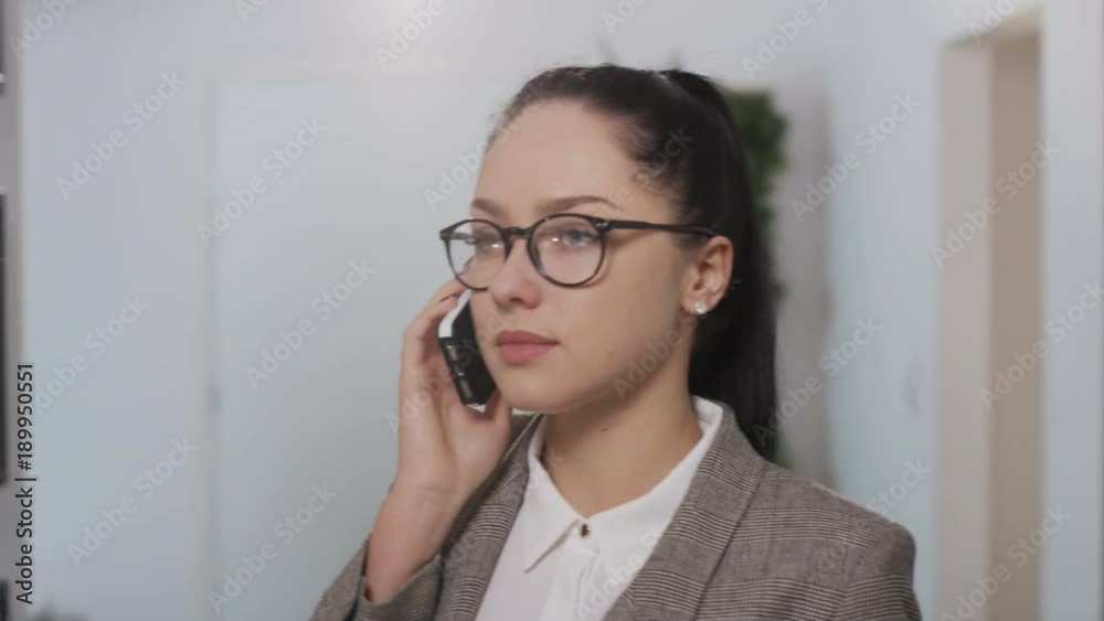 Woman Walking and Making Gestures During a Phone Call Woman Walking and Making Gestures During a Phone Call