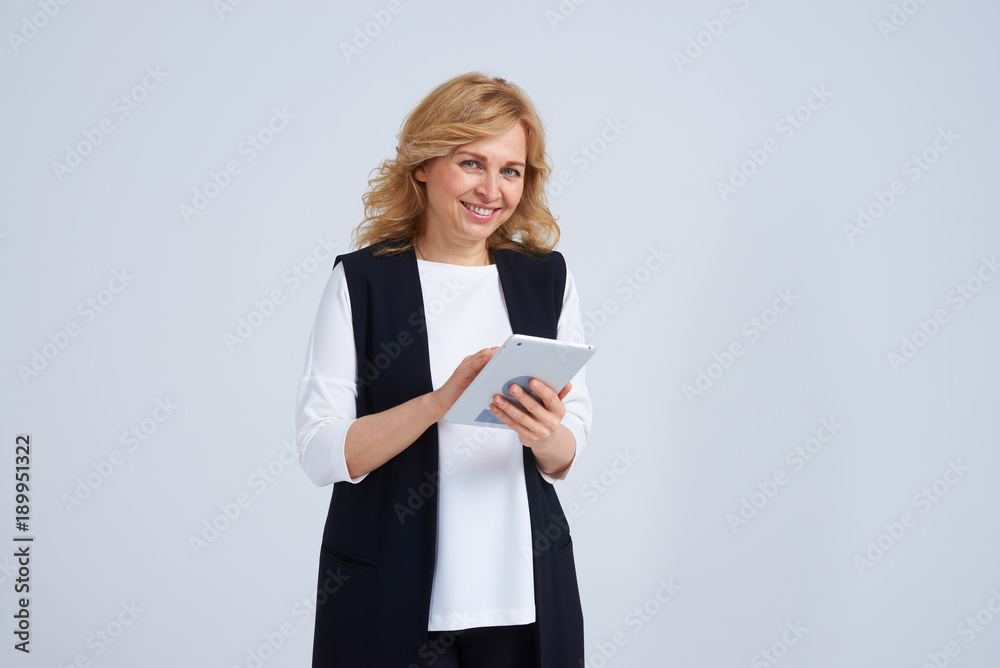 Smiley blond working with tablet Smiley blond working with tablet