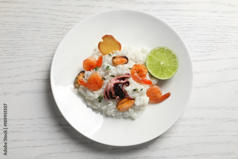 Plate with tasty seafood risotto on table Plate with tasty seafood risotto on table