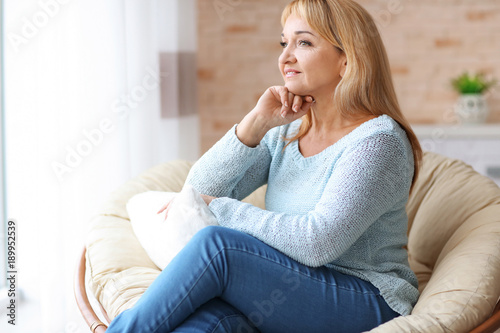 Happy mature woman relaxing...