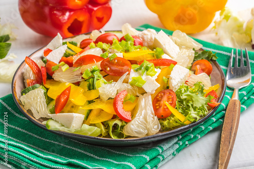 Salad with cheese and fresh vegetables.