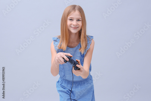 Happy teenage girl with vid...