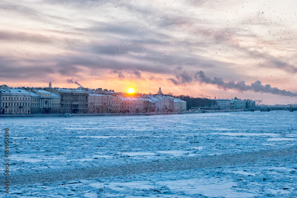View of the frozen Neva River and the city in cold and frosty winter day. Saint-Petersburg. Russia