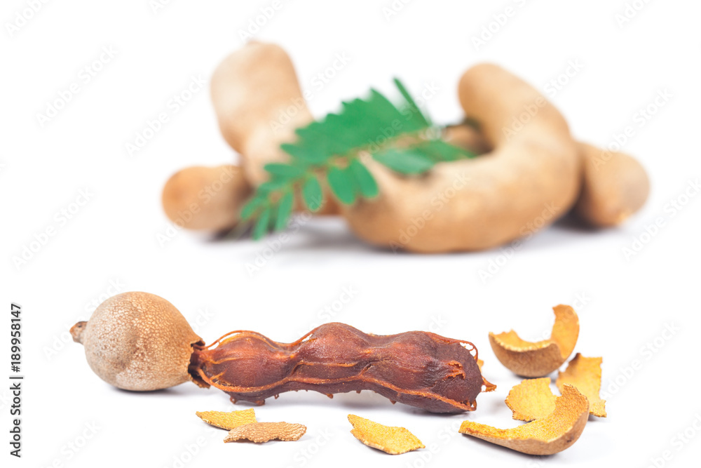 Fototapeta premium tamarind - Sweet ripe tamarind with isolated on a white background. soft focus 