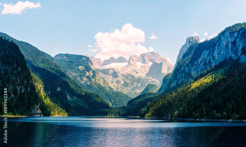 Fantastic morning on mountain lake Gosausee, located in the Austia. Dramatic unusual scene. Alps, Europe. Landscape photography