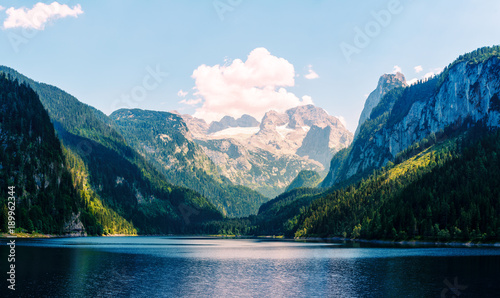 Fantastic morning on mountain lake Gosausee, located in the Austia. Dramatic unusual scene. Alps, Europe. Landscape photography